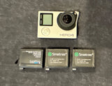 GoPro HERO4 action camera with lens and 3 Smatree battery packs
