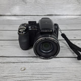 Black Fujifilm FinePix digital camera with lens and wrist strap