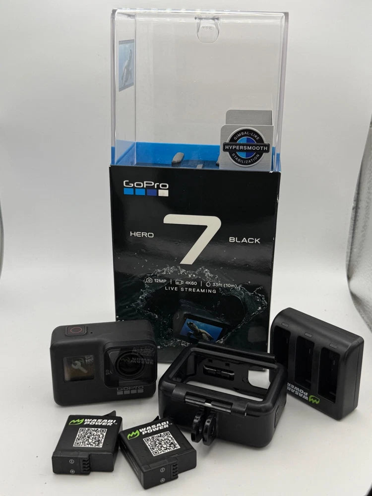 GoPro HERO7 Black action camera kit with original box, camera, and batteries/chargers