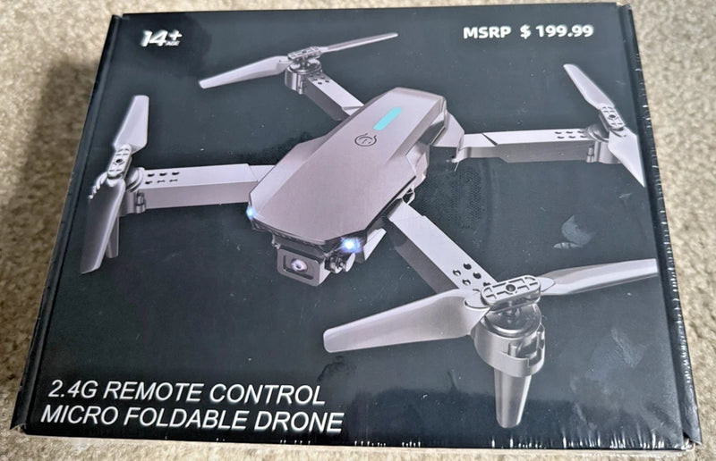 Micro foldable remote control drone with four propellers, gray body