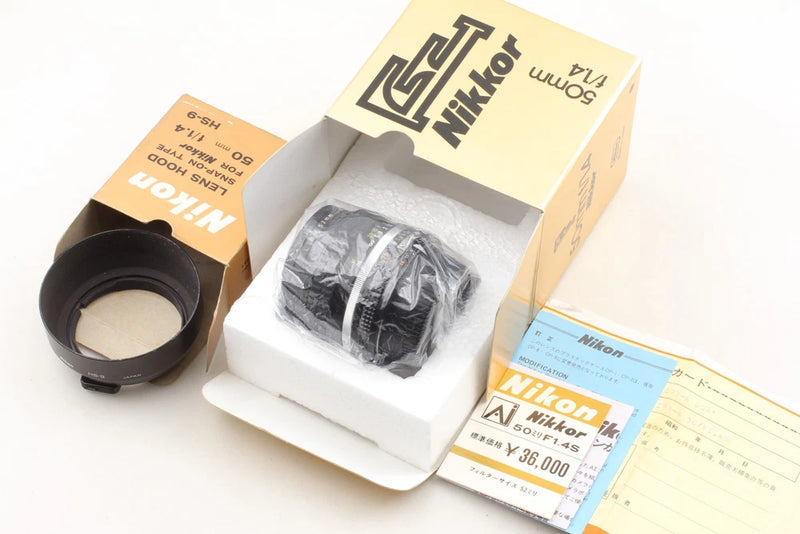 Nikon manual focus 50mm f/1.4 lens with protective packaging and box