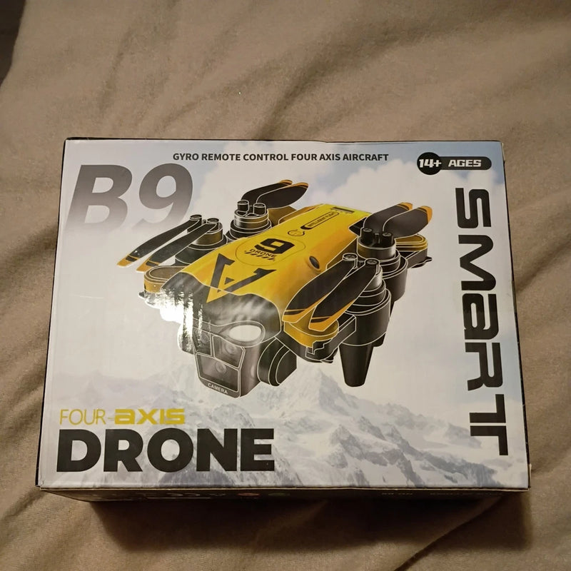 Boxed quad-rotor dual-camera drone, yellow and black with 8K label