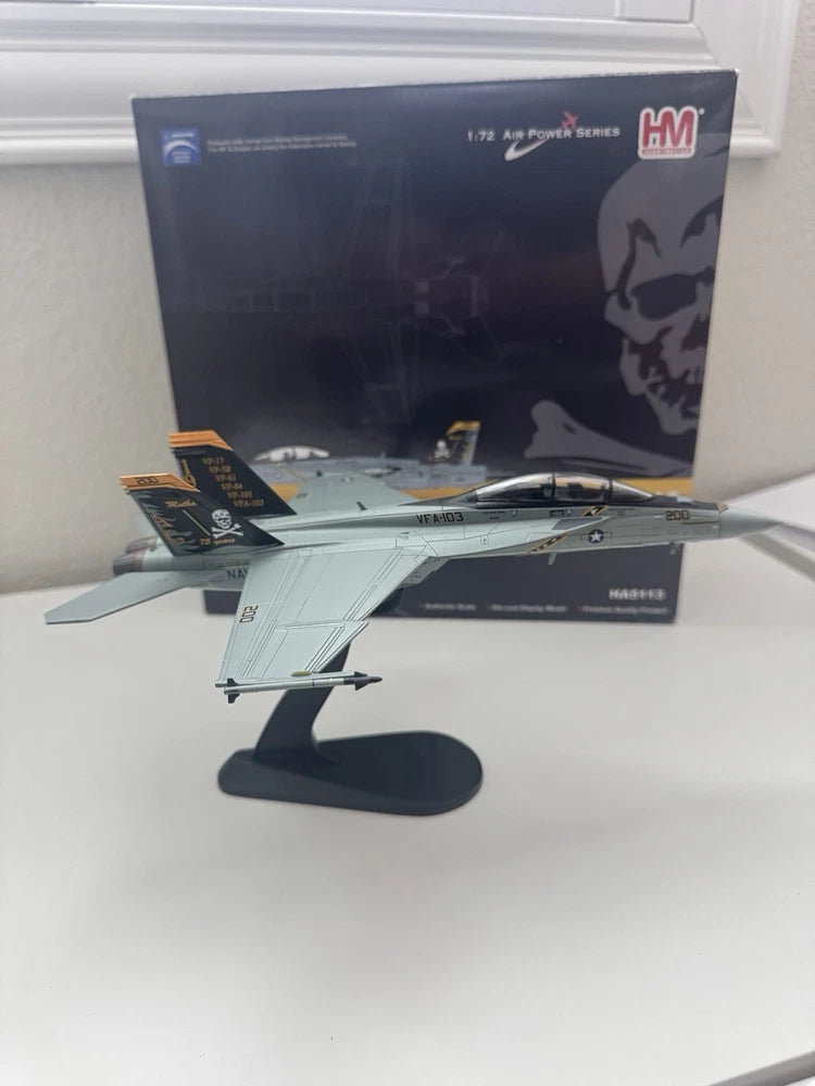 Gray F/A-18F Super Hornet die-cast model on display stand, Jolly Rogers livery