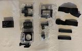 Waterproof action camera with mounting accessories and black straps in packaging