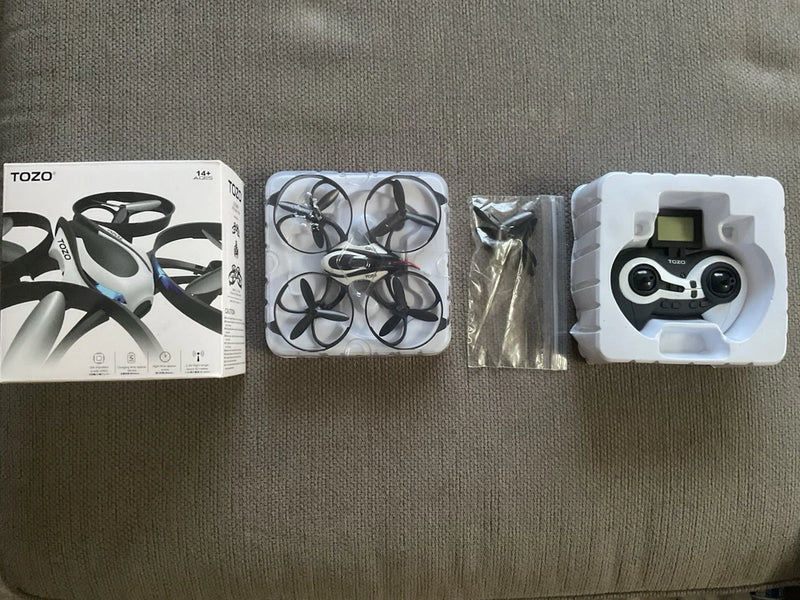 Tozo beginner drone kit with packaged drone parts and remote controller