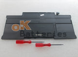 Dark laptop battery pack with connectors and label, flat rectangular shape