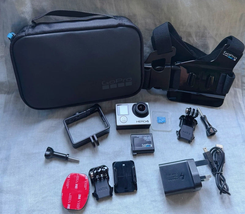 GoPro HERO4 action camera kit with touch LCD, mounts, battery, and carrying case