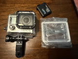 GoPro Hero 4 with waterproof housing, open back, and extra battery EX