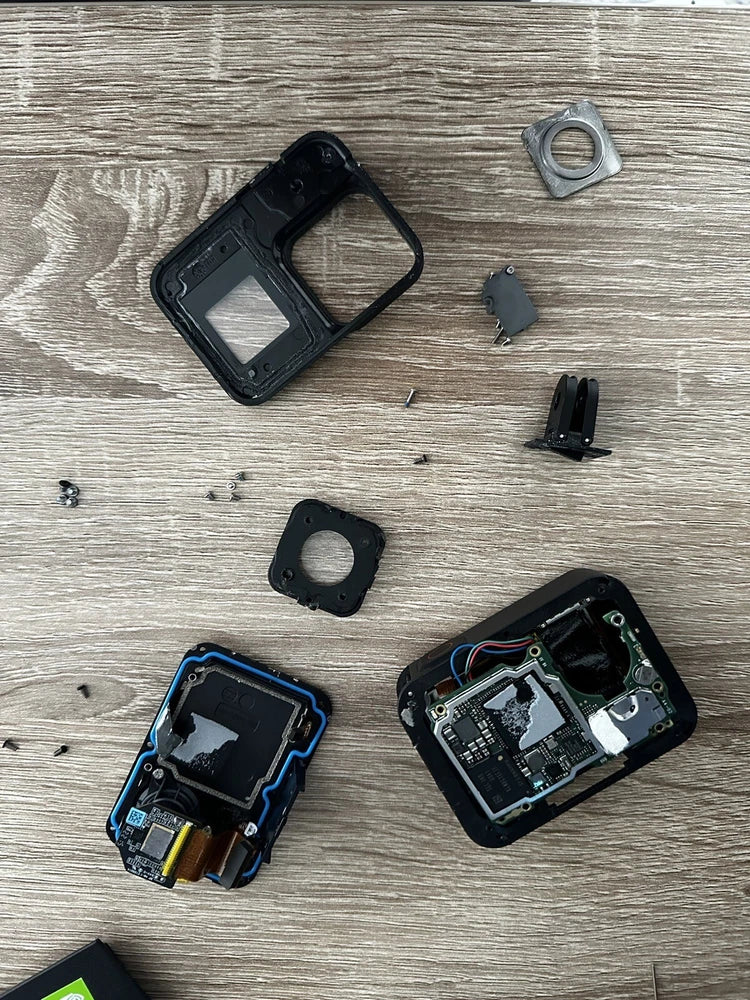 GoPro Hero 8 action camera, disassembled black housing with circuit boards and parts