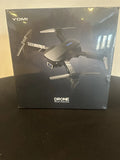 Black YOMI quadcopter drone model kit box with front view of drone