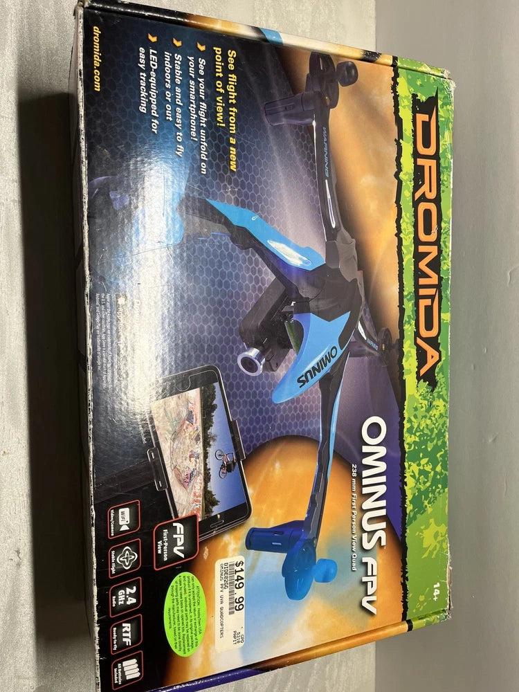 Blue drone toy on retail product box, visible propeller and control labels