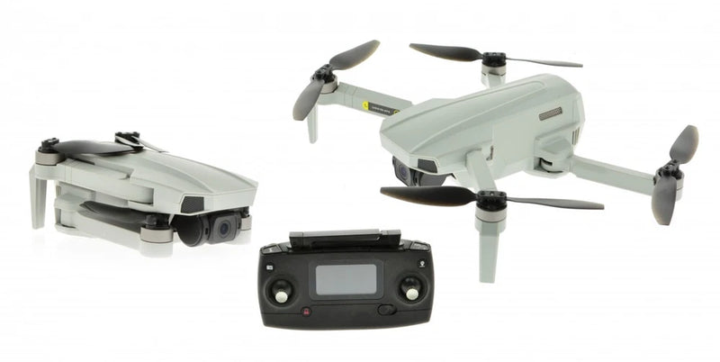 Light gray quadcopter drone with four propellers and FPV remote controller with screen