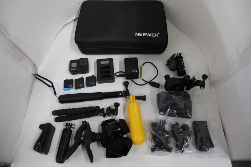 GoPro Hero 8 black action camera accessory kit with case, mounts, batteries, and clips