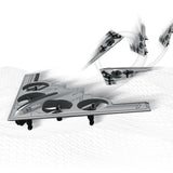 Gray stealth bomber RC plane with wings and landing gear, multi-rotor props