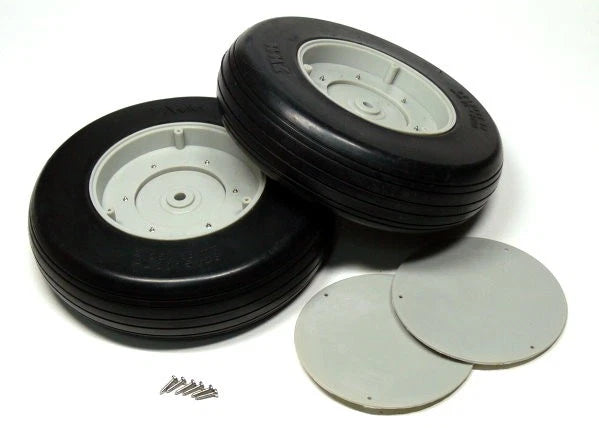 Pair of black rubber RC model airplane tires with white wheel hubs, plus screws and caps