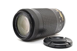 Nikon AF-P 70-300mm camera lens with textured focus ring and front glass, includes cap