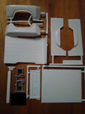Light gray model pickup truck bed and tailgate side panels with hinges