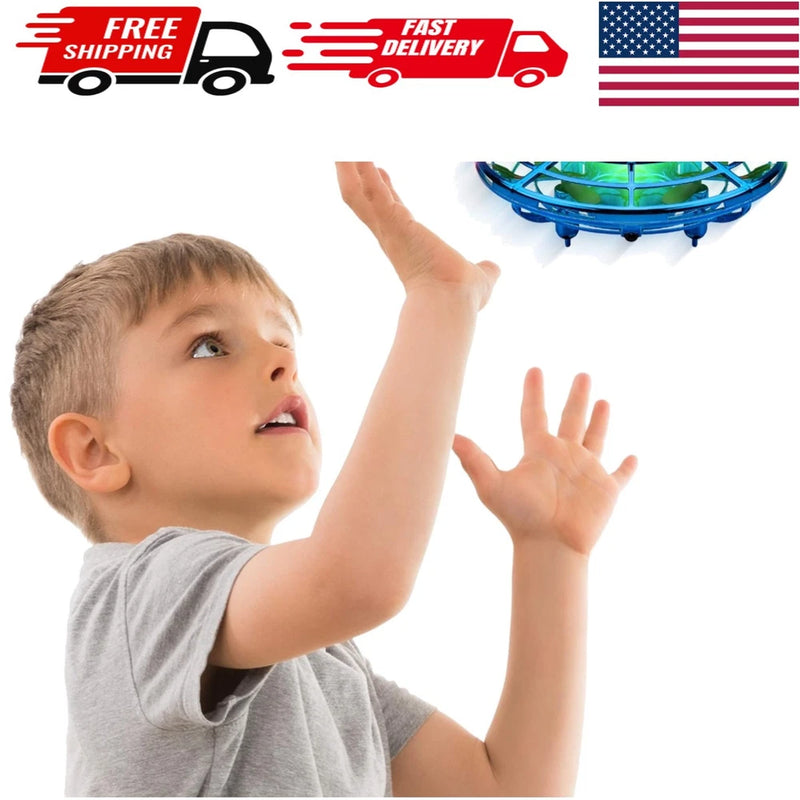 Blue LED mini flying orb drone with glowing green lights, shown with raised hands