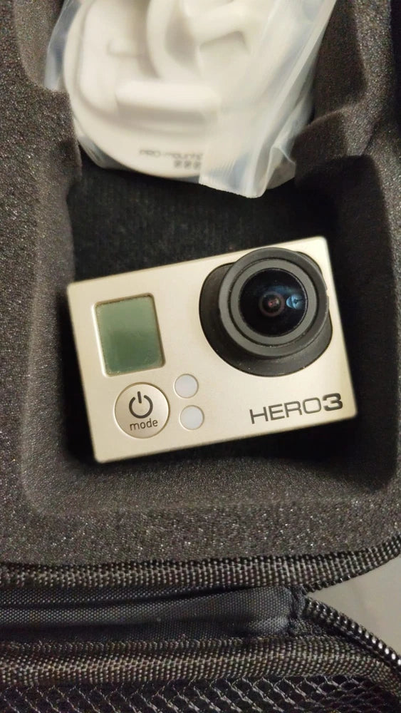 GoPro HERO3 action camera with screen and lens, buttons on white body