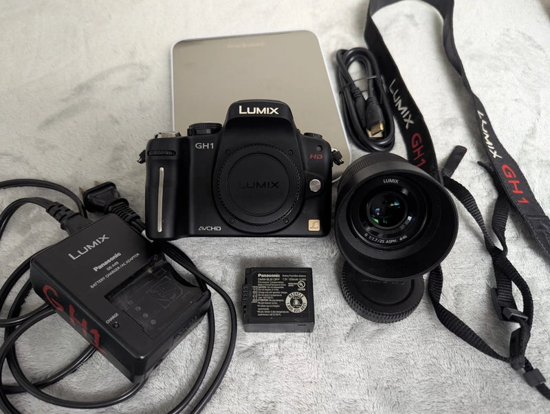 Panasonic LUMIX GH1 mirrorless camera kit with 25mm lens, battery, charger, strap