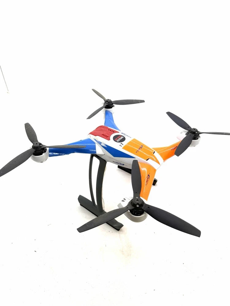 Blue and orange quadcopter drone with four propellers and landing stand