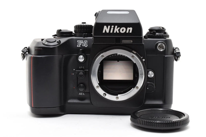 Black Nikon F4 SLR 35mm film camera body with lens mount opening, top Nikon logo