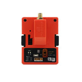 FrSky 900MHz R9M long-range RF module with orange housing and antenna connector