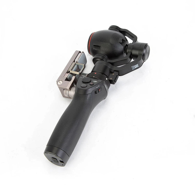 Handheld gimbal stabilizer with attached camera, DJI Osmo+.