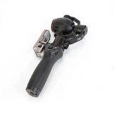 Handheld gimbal stabilizer with attached camera, DJI Osmo+.