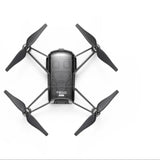 Black mini quadcopter drone with four propellers and central camera body