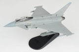 1/72 scale gray jet model with RAF-style markings, on black display base