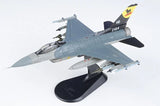 Light gray F-16C fighter jet model on black display stand with missiles