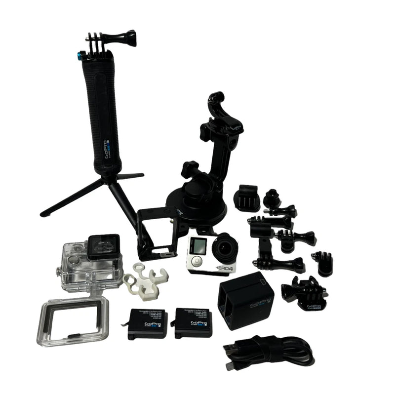 GoPro HERO4 action camera kit with camera, mounts, waterproof case, batteries, and cords