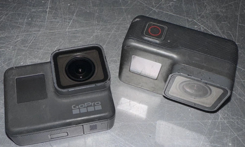 GoPro HERO3+ action camera with front lens and waterproof housing, side ports visible