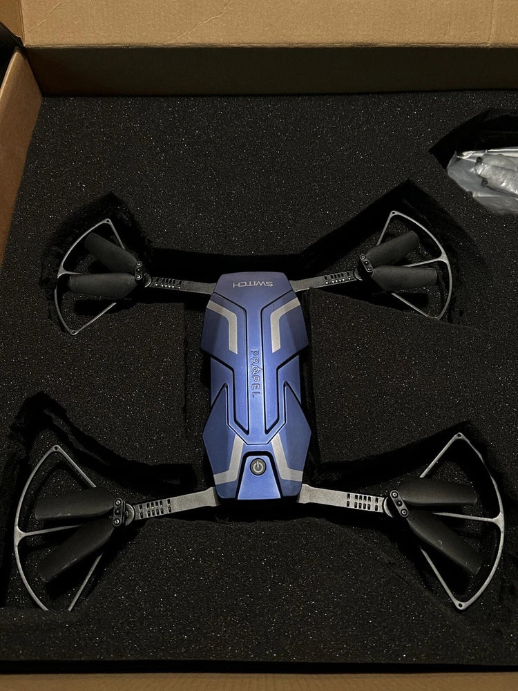 Blue folding quadcopter drone with four propellers and onboard HD camera