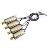 RC quad motor with metal housings, gold shafts, and multicolor wire leads