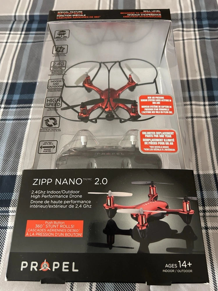 Red nano quadcopter drone in retail box, 2.4 GHz indoor/outdoor