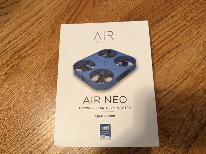 AirSelfie Air Neo pocket drone retail box with blue quadcopter photo