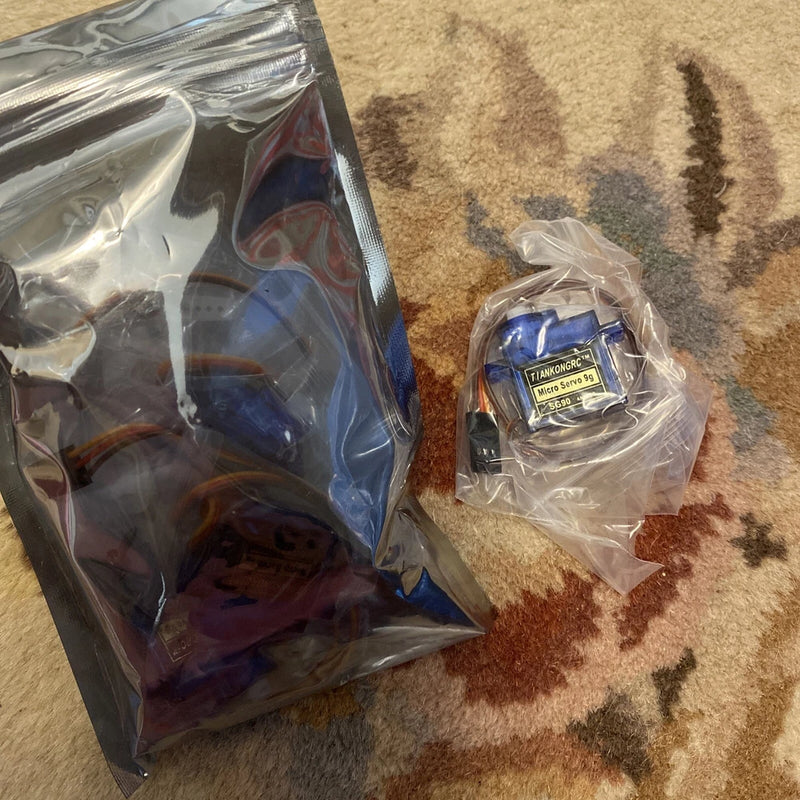 Micro servo motor set in plastic bags, labeled 9g MG90S high speed