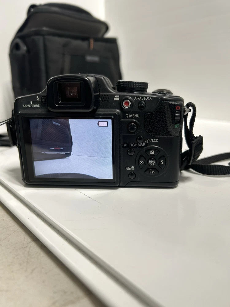 Black Panasonic Lumix digital camera with LCD screen and built-in controls