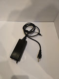 Black AC power adapter with attached cord and two-prong plug