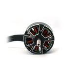 Brushless FPV motor with black housing, colorful stator, and wire leads