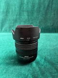 Nikon DX zoom camera lens with front hood and ribbed focus ring