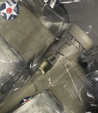 Gray WWII-style model airplane with wings and nose, inside clear display packaging