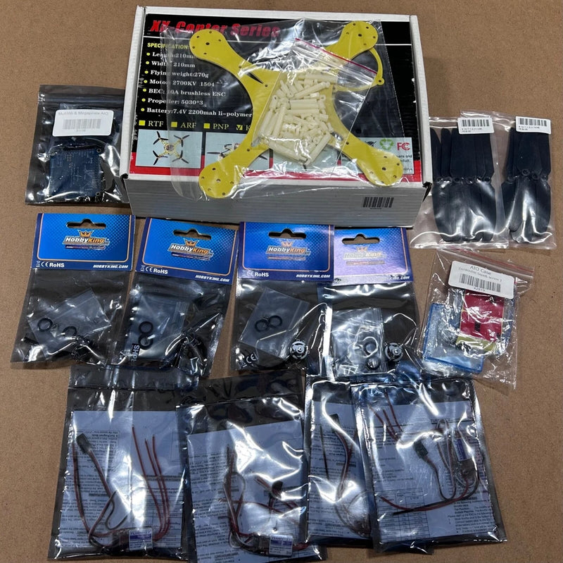 HOBBYKING drone kit parts: yellow mini quadcopter frame, motors, ESC and cables in packs