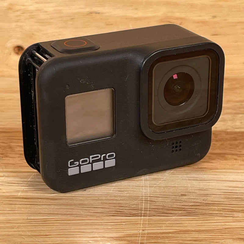 Black action camera for parts with front lens, display screen, and GoPro logo