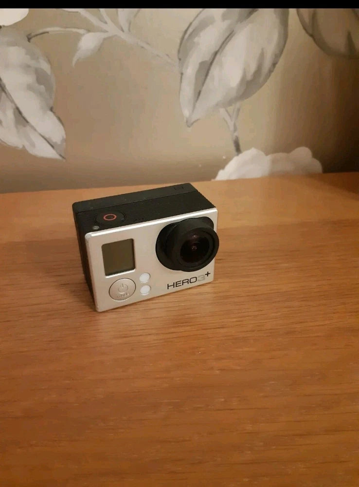 GoPro HERO3+ action camera, white, with front lens and status screen