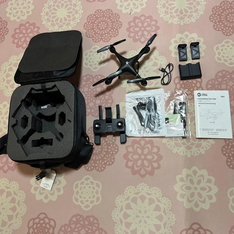 Black hard-shell drone case with GPS FPV quadcopter and accessory parts