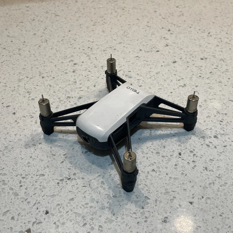 DJI Tello dummy display unit drone with white body and black quadcopter arms