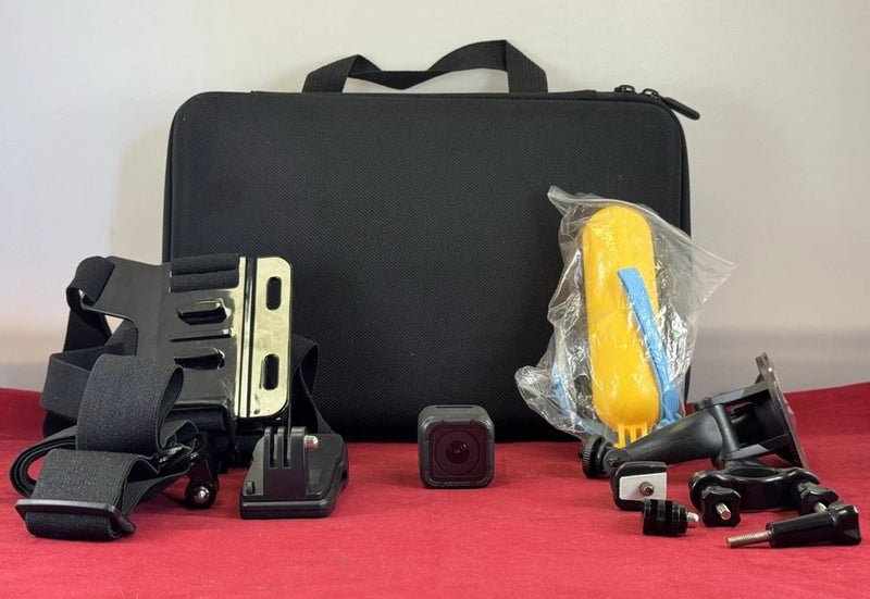 Compact action camera with mounts and black carrying case